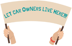 Two hands holding a sign that says: Let Car Owners Live Here!!!